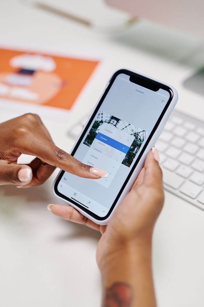 Crafting Captivating Headlines: Your awesome post title goes here Close-up of hands interacting with a smartphone for online scheduling, showcasing modern digital convenience.